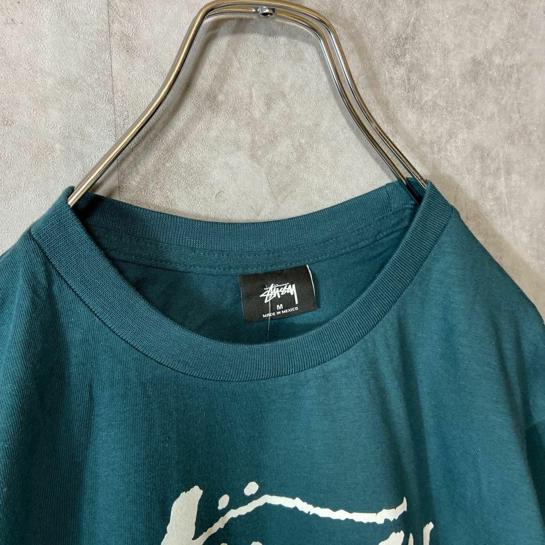 STUSSY(ステューシー)の【タグ付き、ワールドツアー】stussy両面プリントロゴTシャツ緑ストリートM メンズのトップス(Tシャツ/カットソー(半袖/袖なし))の商品写真