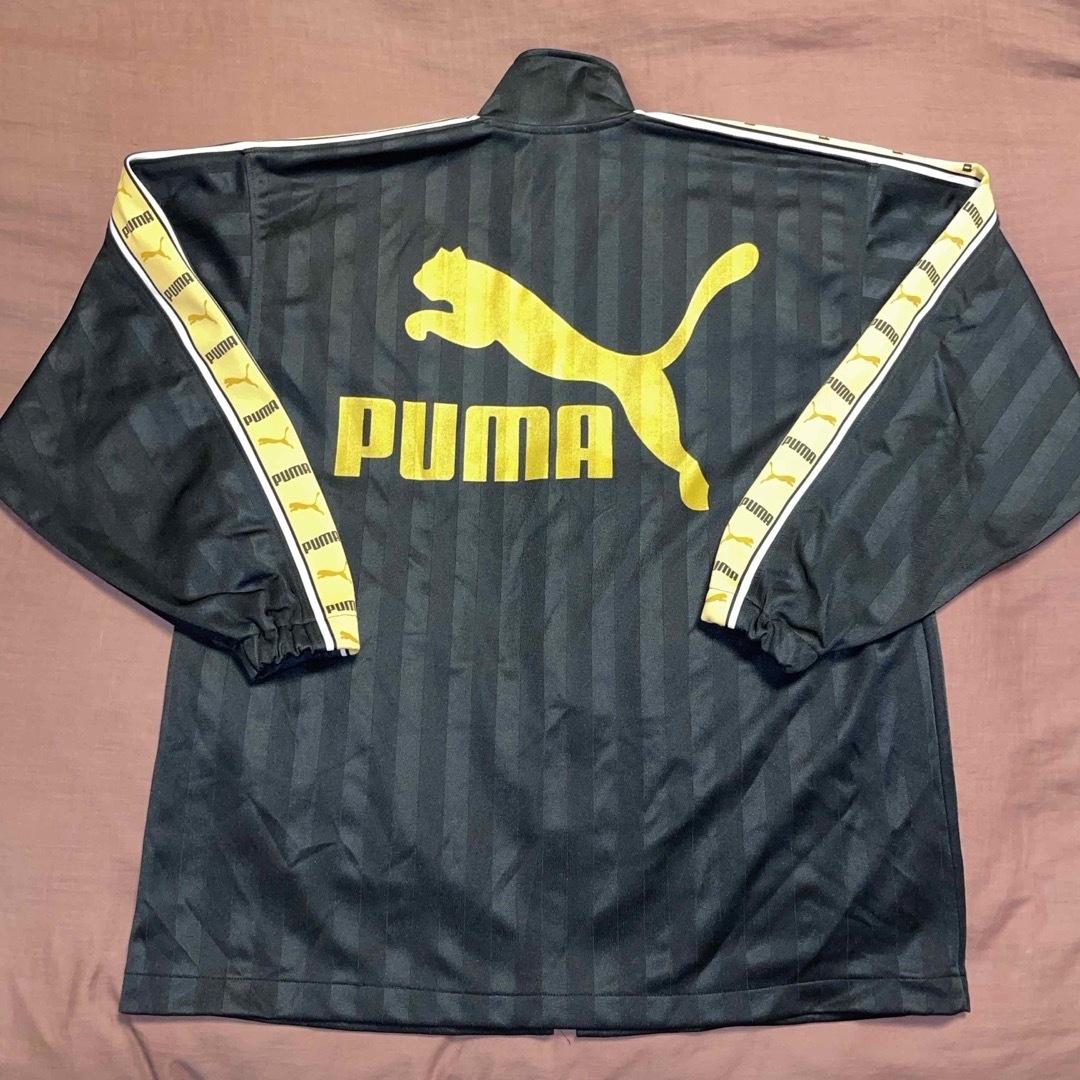 PUMA(プーマ)のPUMA プーマ ビックロゴ ジャージ ブラック  ゴールド サイズ 表記 M メンズのトップス(ジャージ)の商品写真