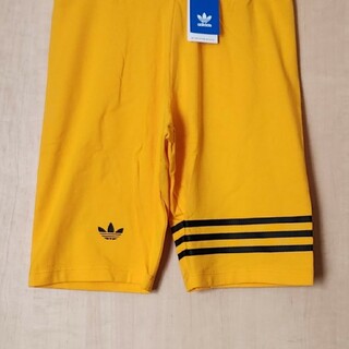 オリジナルス(Originals（adidas）)のアディダス オリジナルス アディカラー バイク レギンス 新品 紙タグ付き(レギンス/スパッツ)