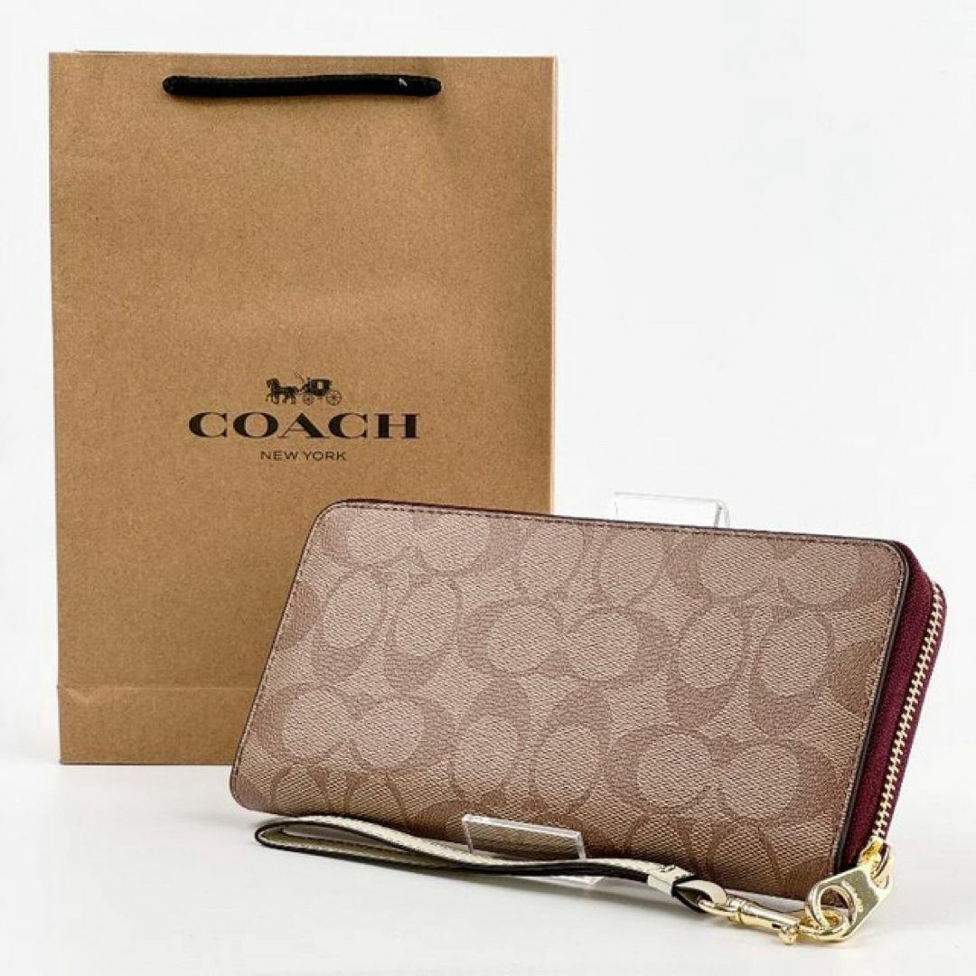 COACH(コーチ)の新品 COACH x スヌーピー ストラップ付き 長財布 PEANUTS 革 レディースのファッション小物(財布)の商品写真