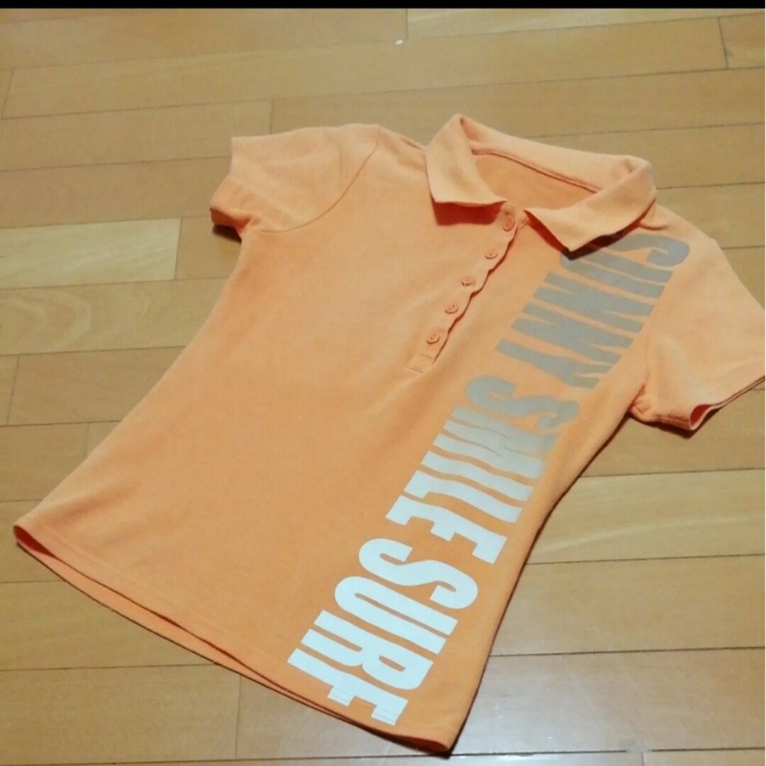 半袖ポロシャツ★Mサイズ　カットソー　オレンジ色　プリント レディースのトップス(ポロシャツ)の商品写真
