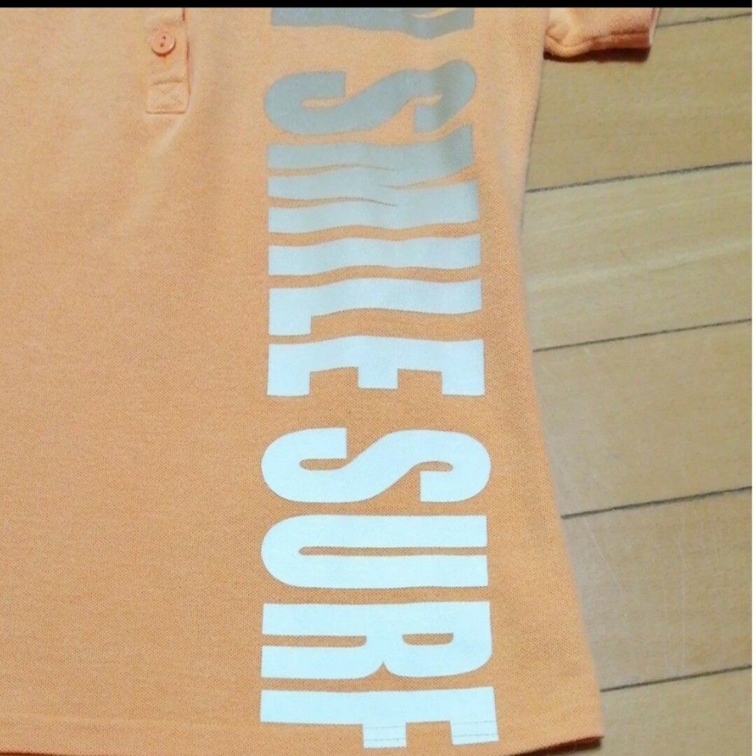 半袖ポロシャツ★Mサイズ　カットソー　オレンジ色　プリント レディースのトップス(ポロシャツ)の商品写真