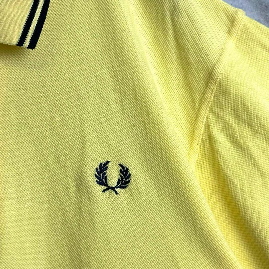 FRED PERRY(フレッドペリー)の美品 英国製 フレッドペリー 鹿子半袖ポロシャツ リンガー 刺繍ロゴ イエローL メンズのトップス(ポロシャツ)の商品写真