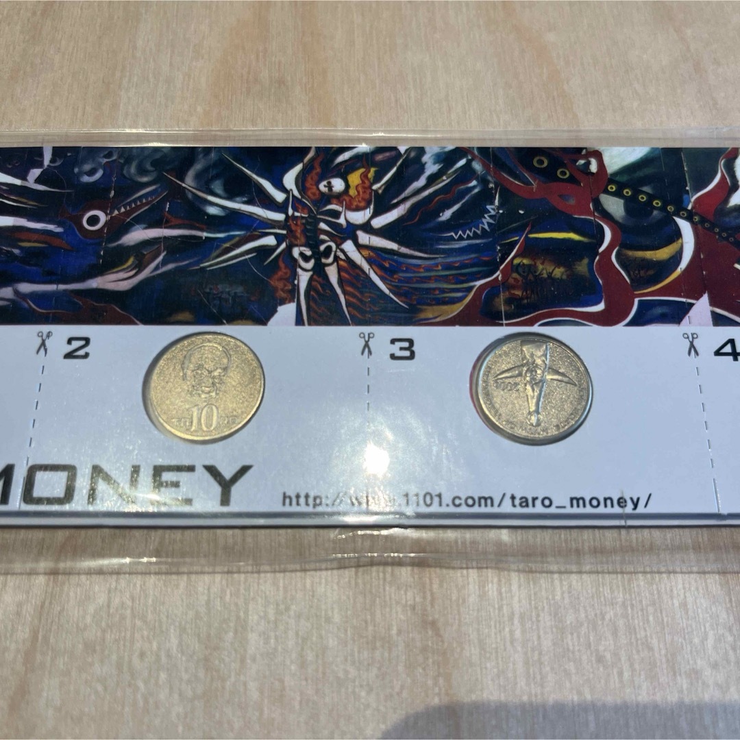 【最終値下げ】岡本太郎記念館公認コイン　TARO MONEY エンタメ/ホビーのタレントグッズ(その他)の商品写真