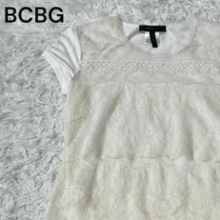 ビーシービージーマックスアズリア(BCBGMAXAZRIA)のBCBG マックスアズリア　レース　アイボリー　Tシャツ　S 柄　花(Tシャツ(半袖/袖なし))