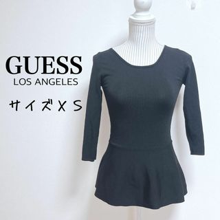 GUESS - ゲス　バッククロスペプラムニットトップス タイトシルエット【XS】セクシー　黒