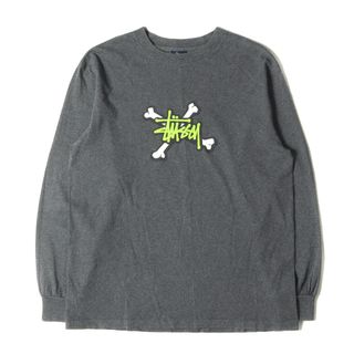 ステューシー(STUSSY)のSTUSSY ステューシー Tシャツ サイズ:M 00s クロスボーン ストックロゴ ロングスリーブTシャツ チャコール トップス カットソー 長袖 クルーネック【メンズ】【中古】(Tシャツ/カットソー(七分/長袖))