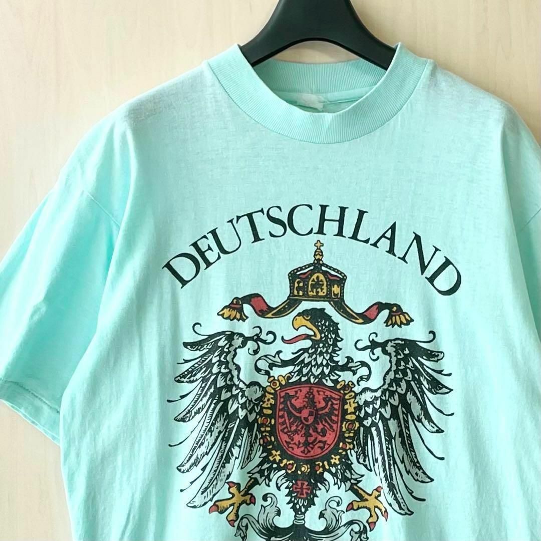 VINTAGE(ヴィンテージ)のヴィンテージ古着　ドイツ国章Tシャツ　　黒鷲　ライヒスアドラー　シングルステッチ メンズのトップス(Tシャツ/カットソー(半袖/袖なし))の商品写真