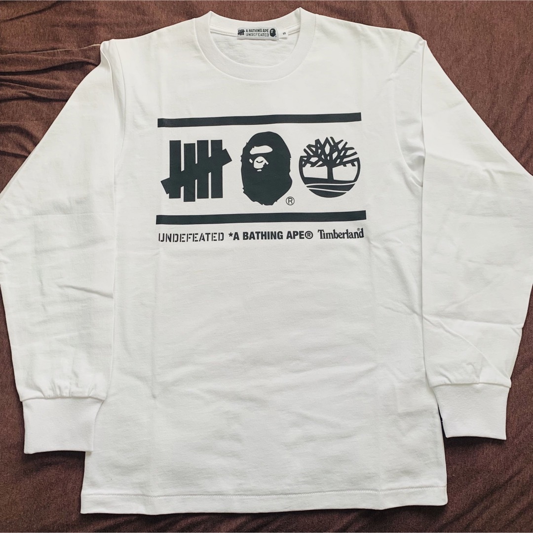 A BATHING APE(アベイシングエイプ)のTIMBERLAND BAPE UNDEFEATED ｴｲﾌﾟ ﾛﾝT メンズのトップス(Tシャツ/カットソー(七分/長袖))の商品写真