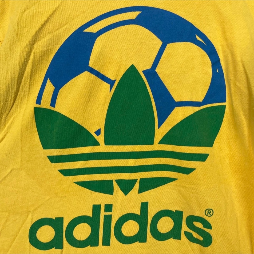 adidas(アディダス)の【アディダス】半袖Tシャツ　トレフォイルロゴ　デカロゴ　イエロー　ブラジル74 メンズのトップス(Tシャツ/カットソー(半袖/袖なし))の商品写真