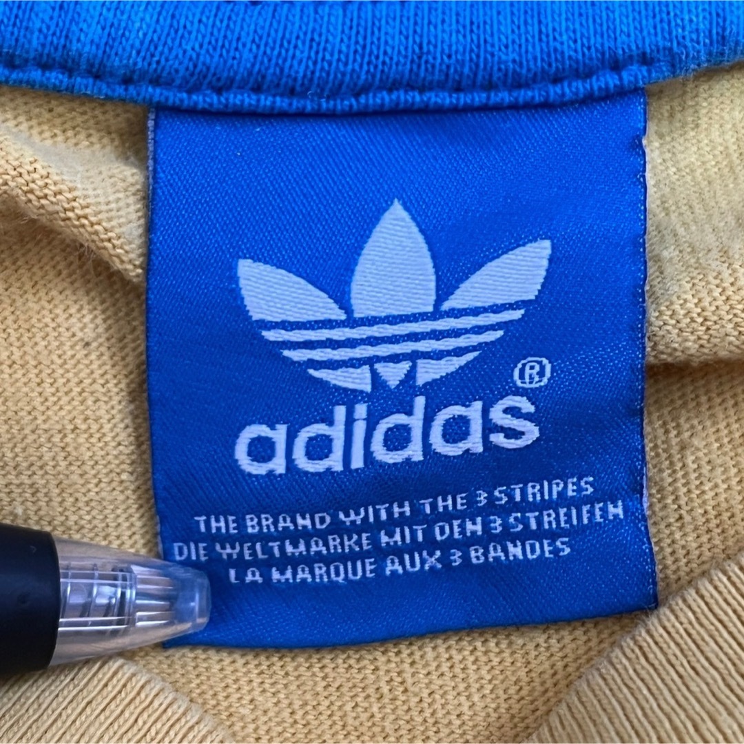 adidas(アディダス)の【アディダス】半袖Tシャツ　トレフォイルロゴ　デカロゴ　イエロー　ブラジル74 メンズのトップス(Tシャツ/カットソー(半袖/袖なし))の商品写真