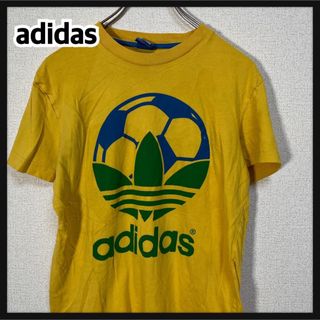 アディダス(adidas)の【アディダス】半袖Tシャツ　トレフォイルロゴ　デカロゴ　イエロー　ブラジル74(Tシャツ/カットソー(半袖/袖なし))