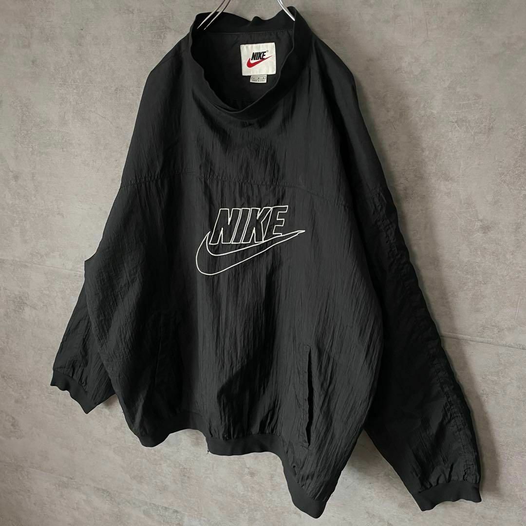 NIKE(ナイキ)の【usa製、ビッグ刺繍ロゴ】NIKEナイロンジャケット古着スウッシュ黒90s メンズのジャケット/アウター(ナイロンジャケット)の商品写真