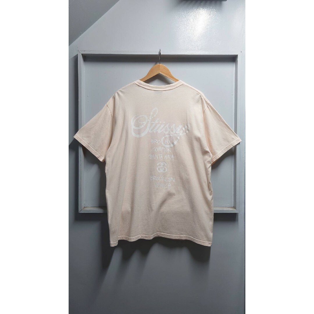 STUSSY(ステューシー)のSTUSSY ワールドツアー 両面プリント Tシャツ ベビーピンク L 半袖 メンズのトップス(Tシャツ/カットソー(半袖/袖なし))の商品写真