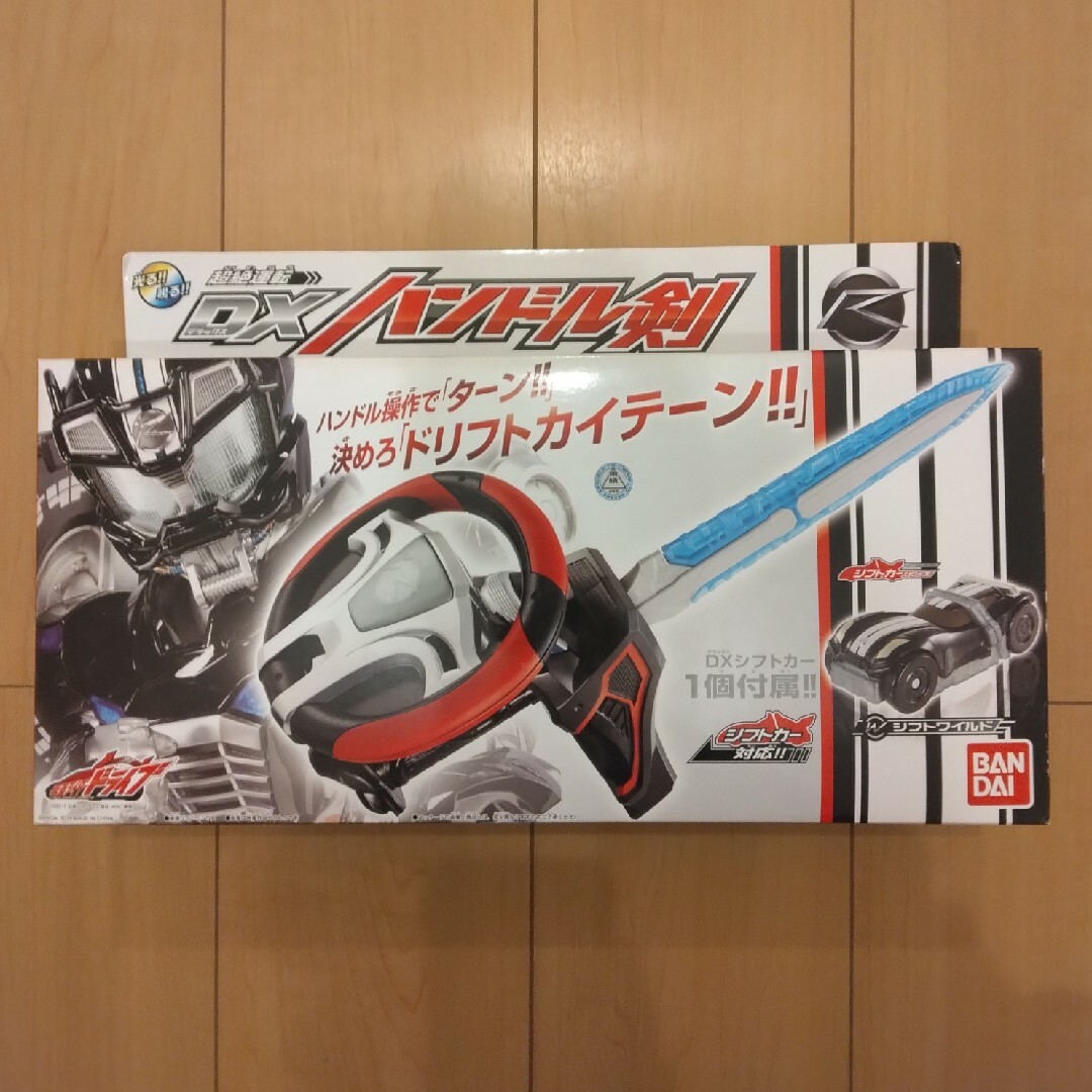 BANDAI(バンダイ)の★未使用、未開封★　仮面ライダードライブ　DXハンドル剣 エンタメ/ホビーのおもちゃ/ぬいぐるみ(キャラクターグッズ)の商品写真