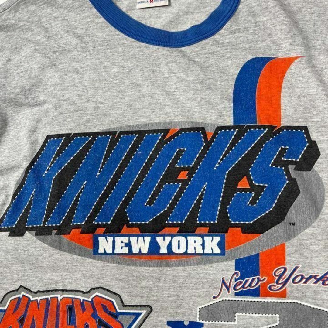 【NBA】90sNewYorkNicksニューヨークニックスラグラン　ストリート メンズのトップス(Tシャツ/カットソー(七分/長袖))の商品写真