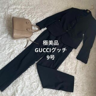 Gucci - 極美品　GUCCI グッチ　パンツスーツ　黒　38  M イタリア製　ロゴボタン