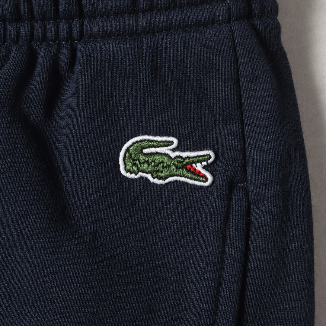 Supreme(シュプリーム)の美品 Supreme シュプリーム パンツ サイズ:M 19AW LACOSTE L!VE パネルロゴ スウェット ショーツ Logo Panel Sweatshort ネイビー 紺 ボトムス ズボン ショートパンツ コラボ【メンズ】【中古】 メンズのパンツ(ショートパンツ)の商品写真