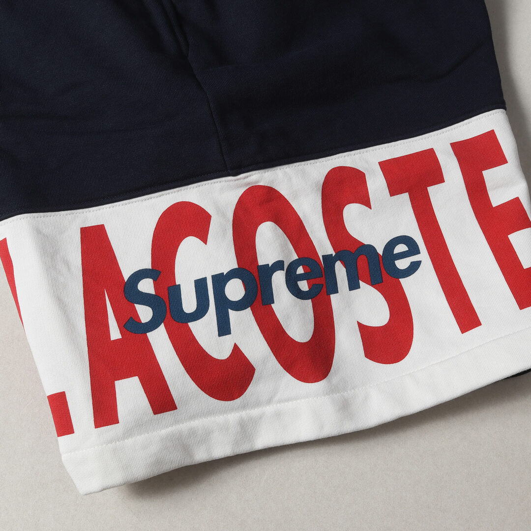 Supreme(シュプリーム)の美品 Supreme シュプリーム パンツ サイズ:M 19AW LACOSTE L!VE パネルロゴ スウェット ショーツ Logo Panel Sweatshort ネイビー 紺 ボトムス ズボン ショートパンツ コラボ【メンズ】【中古】 メンズのパンツ(ショートパンツ)の商品写真