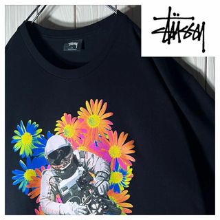 ステューシー(STUSSY)の【新品 L】ステューシー stussy アストロノーツ フラワー Tシャツ 黒(Tシャツ/カットソー(半袖/袖なし))