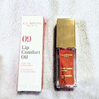 クラランス(CLARINS)の【新品未使用】クラランス　リップコンフォートオイル　09 レッドベリーグラム(リップグロス)