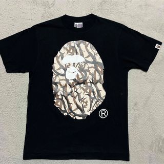 A BATHING APE - APE BAPE KAWS トライバルカモ　BIG HEAD tシャツ　STA