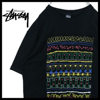 ステューシー(STUSSY)の【STUSSY】カラフル　トライバル柄　Tシャツ(Tシャツ/カットソー(半袖/袖なし))