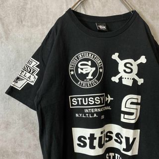 ステューシー(STUSSY)の【4面総柄マルチロゴ】stussyクラウンロゴ古着スカル奇抜一点ものストリート(Tシャツ/カットソー(半袖/袖なし))