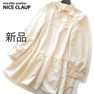 one after another NICE CLAUP - 新品NICE CLAUP バックリボンフレアチュニックブラウス/BE
