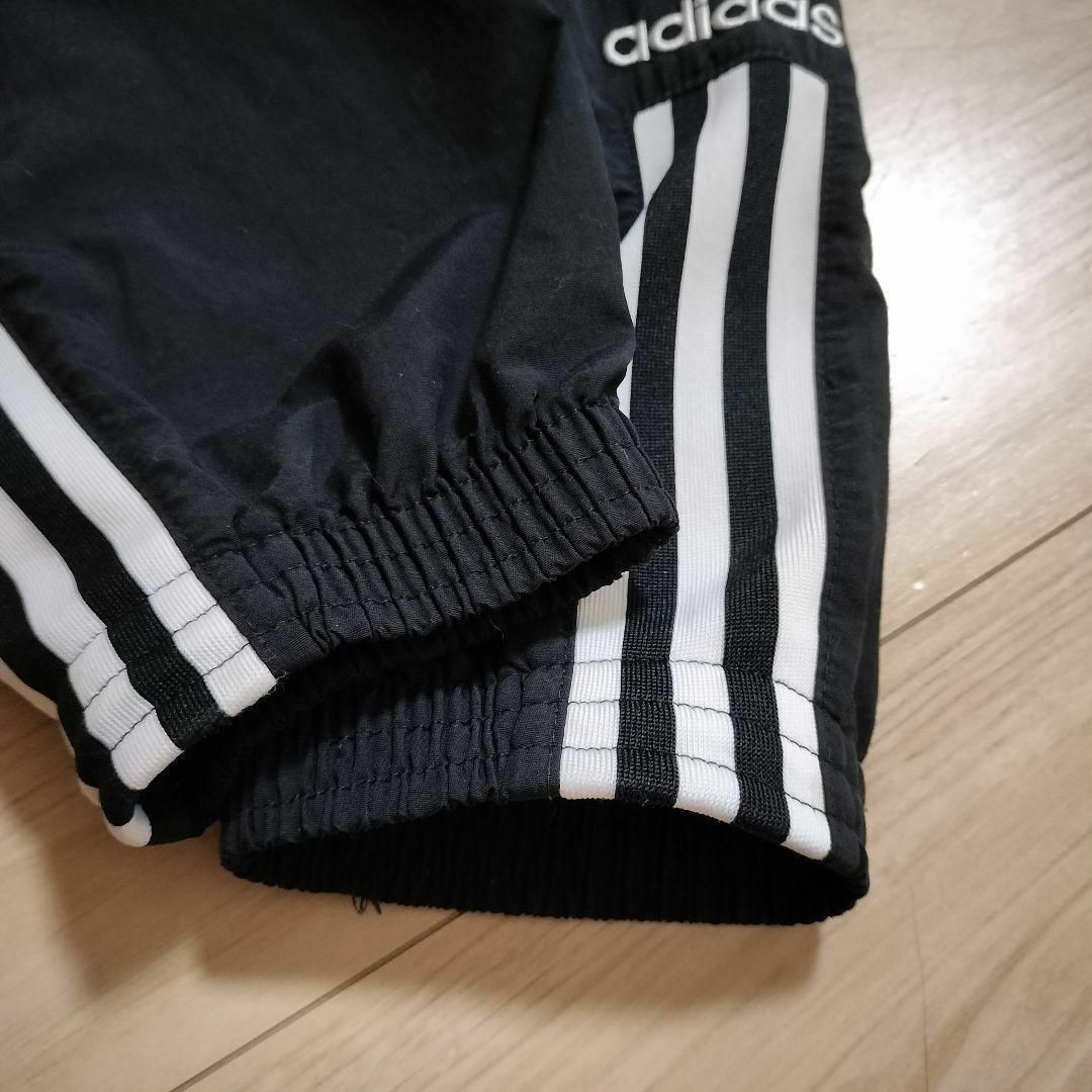 Originals（adidas）(オリジナルス)のアディダス 黒 ロックアップ ウーブンパンツ ジャージ シャカパン 女性M 刺繍 レディースのパンツ(その他)の商品写真