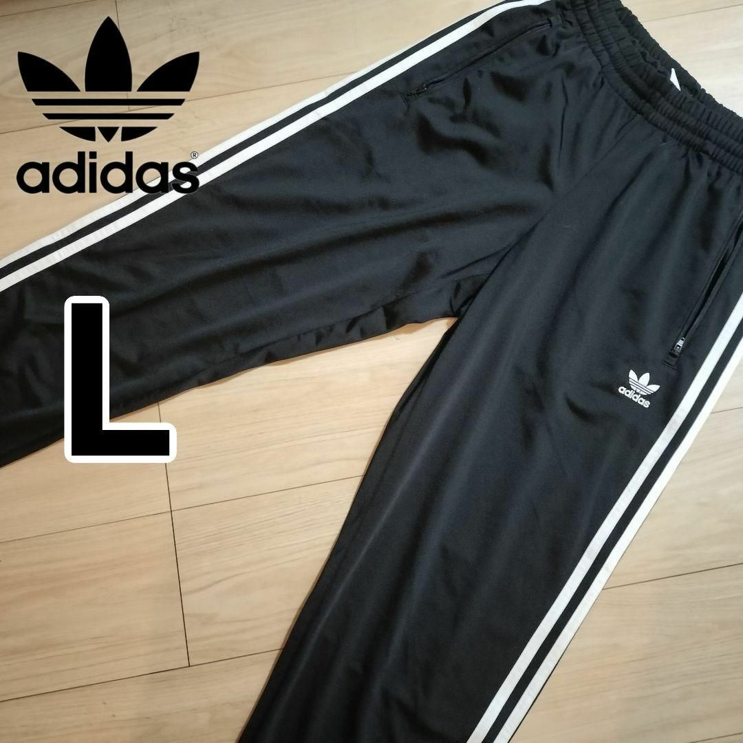 Originals（adidas）(オリジナルス)のアディダス 黒 ファイヤーバード トラックパンツ ジャージ下 人気 男性L スポーツ/アウトドアのスポーツ/アウトドア その他(その他)の商品写真