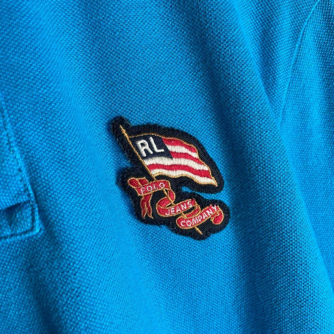 VINTAGE(ヴィンテージ)の[古着]ラルフローレン　半袖　ポロシャツ　国旗　星条旗　刺繍　メタルボタン　青 メンズのトップス(ポロシャツ)の商品写真
