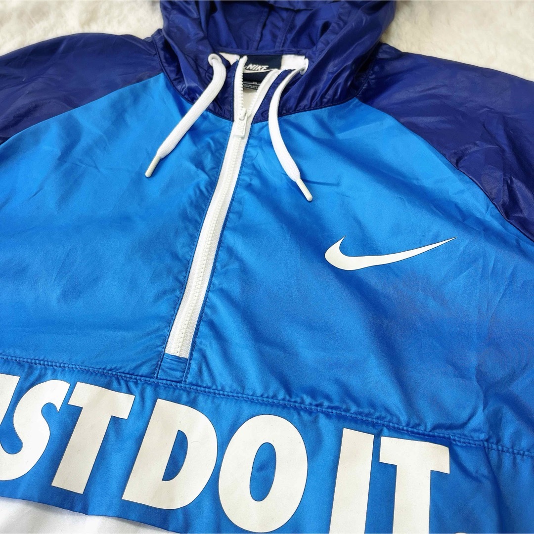 NIKE(ナイキ)のNIKEナイキ ナイロン JUST DO IT ウインドブレーカー ハーフジップ レディースのジャケット/アウター(ナイロンジャケット)の商品写真