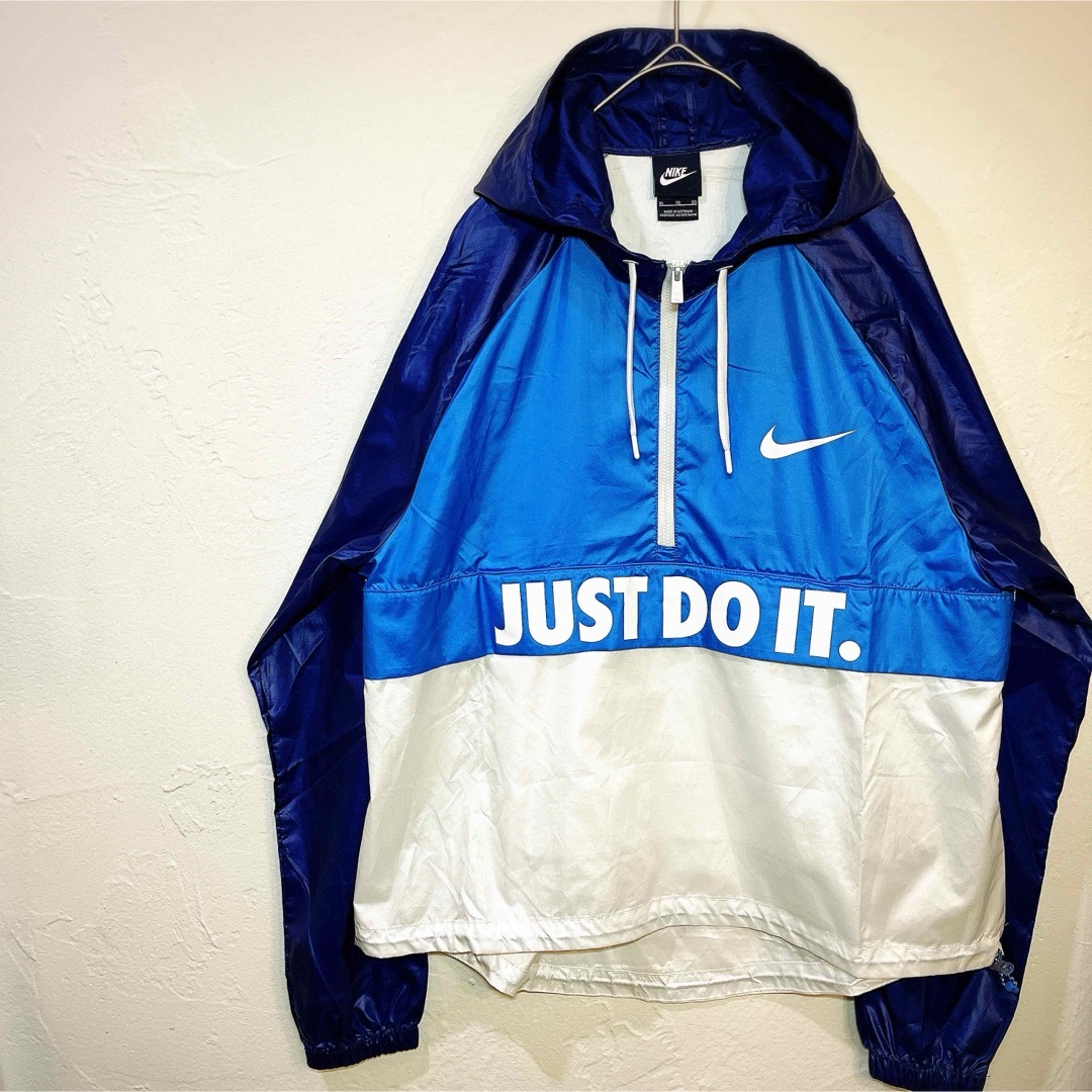 NIKE(ナイキ)のNIKEナイキ ナイロン JUST DO IT ウインドブレーカー ハーフジップ レディースのジャケット/アウター(ナイロンジャケット)の商品写真