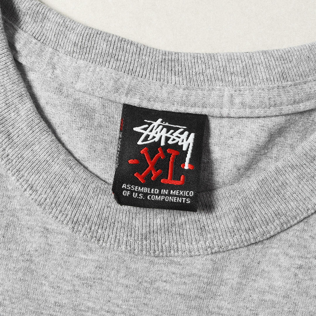 STUSSY(ステューシー)の美品 STUSSY ステューシー Tシャツ サイズ:XL 00s グラフィック プリント ロングスリーブTシャツ ヘザーグレー トップス カットソー 長袖【メンズ】【中古】 メンズのトップス(Tシャツ/カットソー(七分/長袖))の商品写真