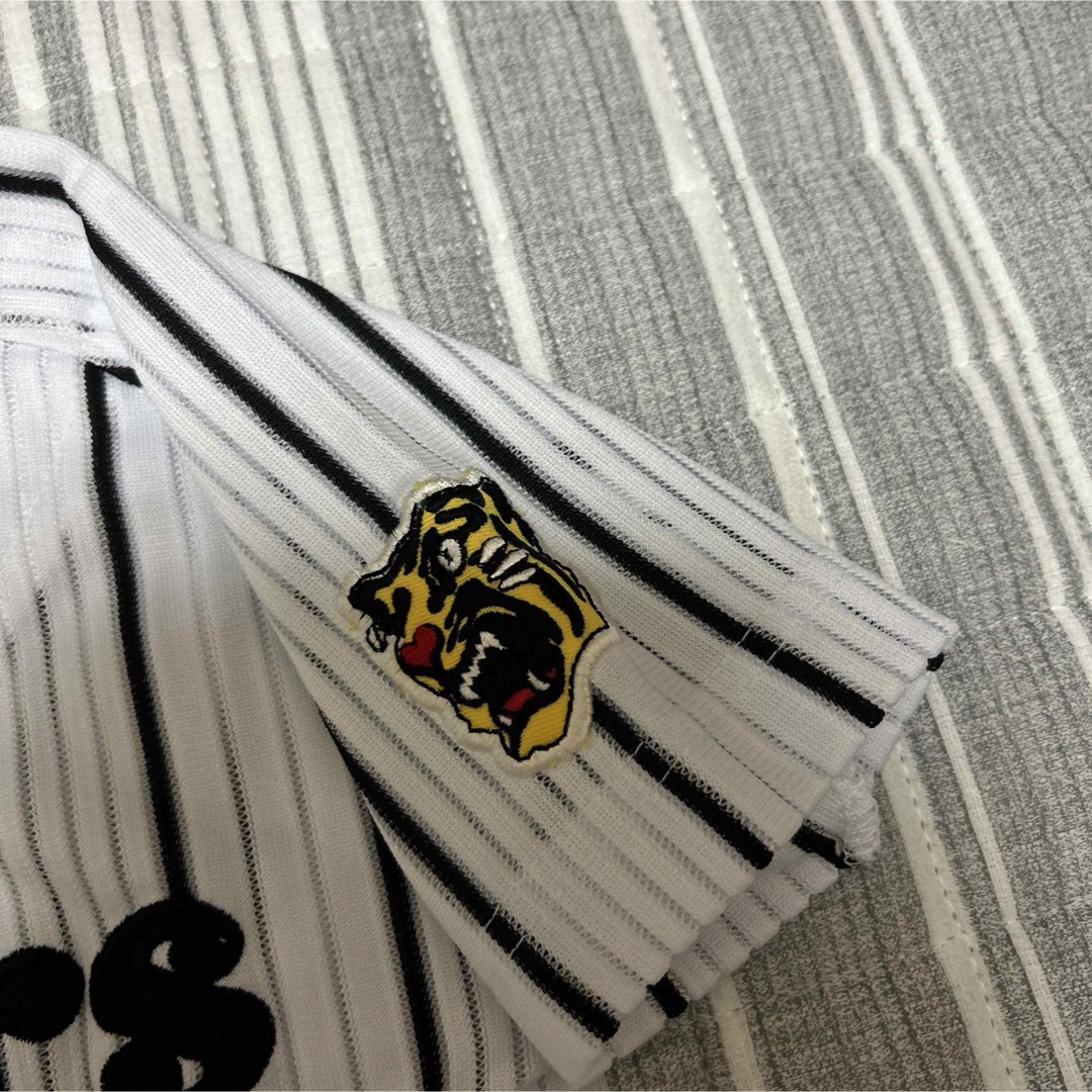 阪神タイガース　白ユニフォーム　シャープ産業　キッズ　100㎝ スポーツ/アウトドアの野球(応援グッズ)の商品写真