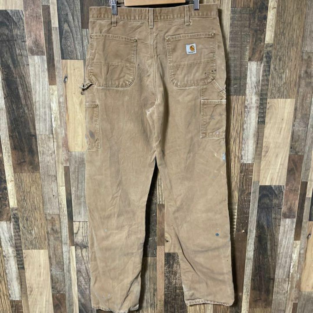 carhartt(カーハート)のカーハート ダブルニー ペンキ ロゴ メンズ L 34 ベージュ パンツ 古着 メンズのパンツ(ワークパンツ/カーゴパンツ)の商品写真