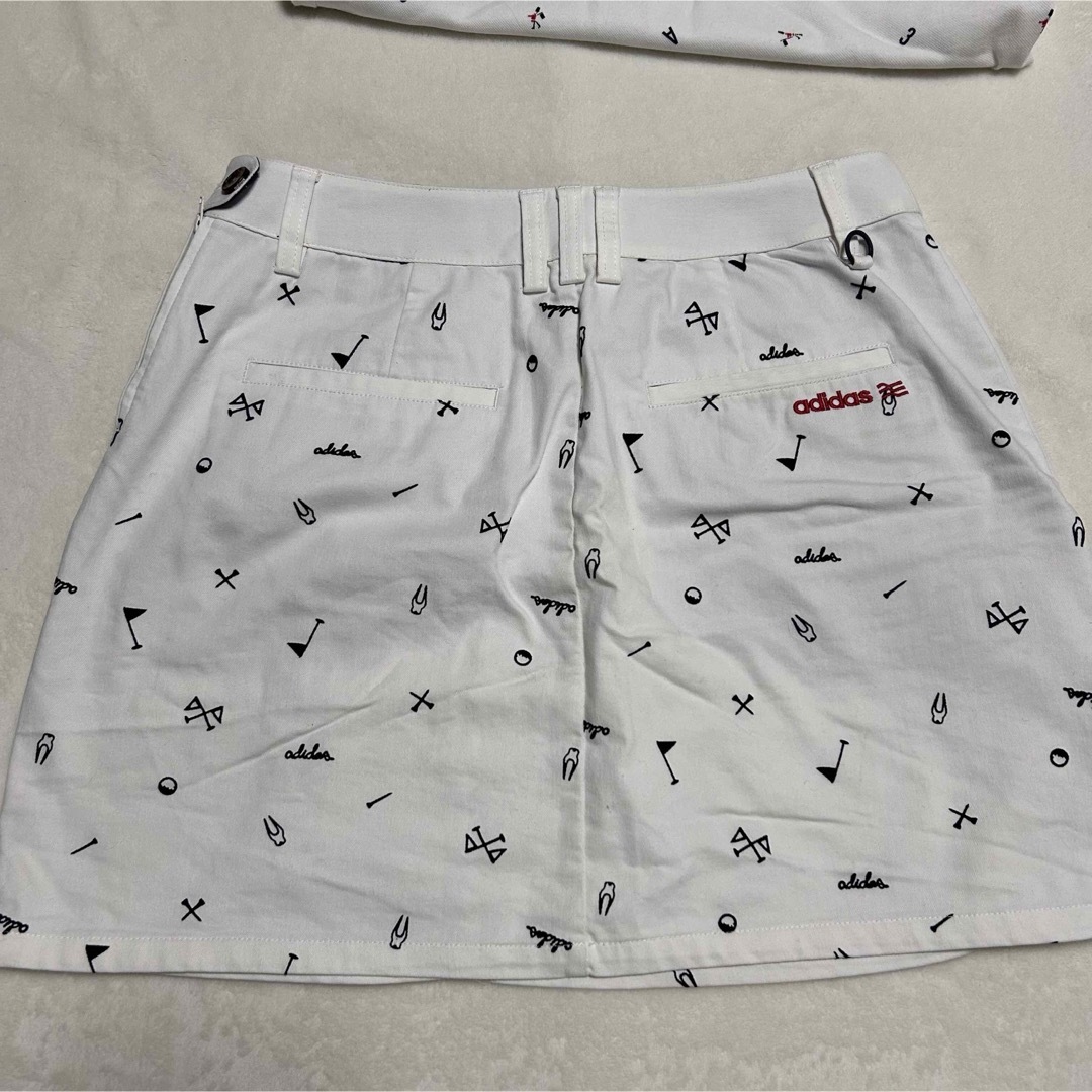 adidas(アディダス)のadidas ゴルフウェア　ポロシャツスカート　セットアップ　ホワイト　総柄 スポーツ/アウトドアのゴルフ(ウエア)の商品写真