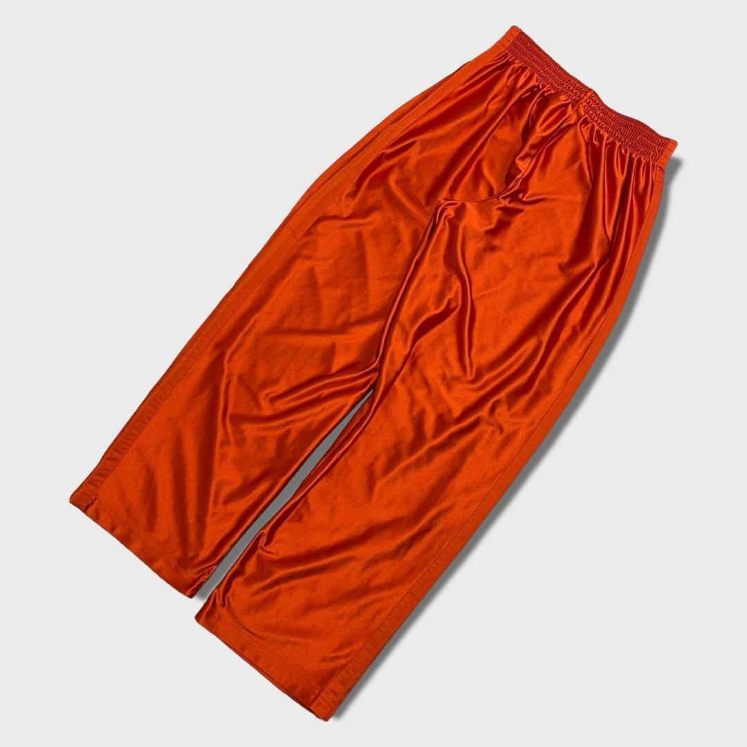 NIKE(ナイキ)のNIKE　トラックパンツ　ワイド　刺繍デザイン　バスケットパンツ　古着　オレンジ その他のその他(その他)の商品写真