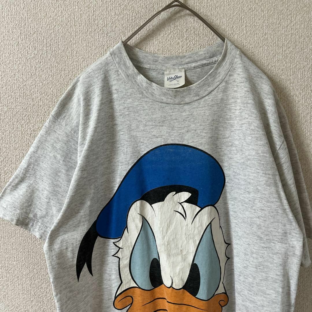 L2 Disney ドナルドダックプリントtシャツ USA製　Mメンズ 灰 メンズのトップス(Tシャツ/カットソー(半袖/袖なし))の商品写真