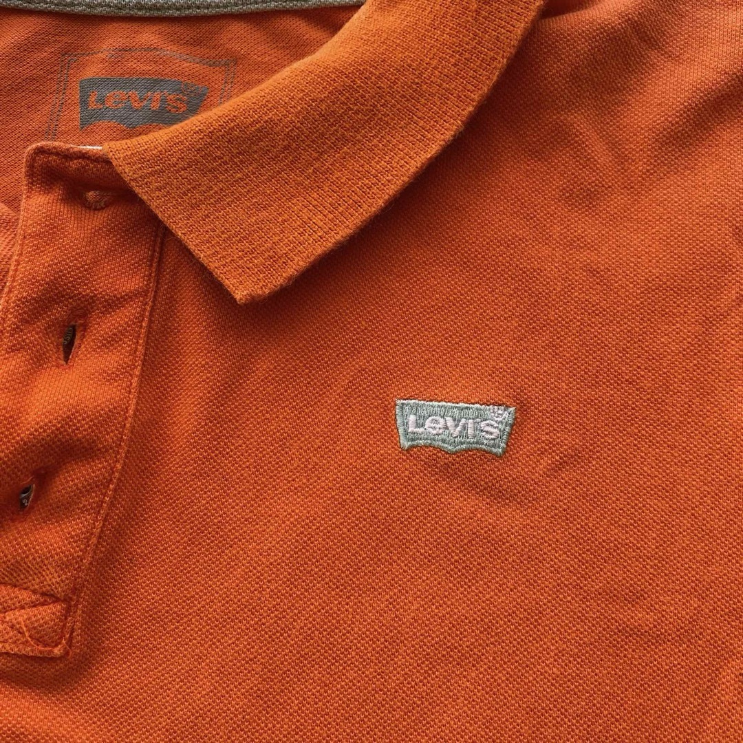 Levi's(リーバイス)のポロシャツ リーバイス 半袖 オレンジ 綿100% 中古 古着 Lサイズ メンズ メンズのトップス(ポロシャツ)の商品写真