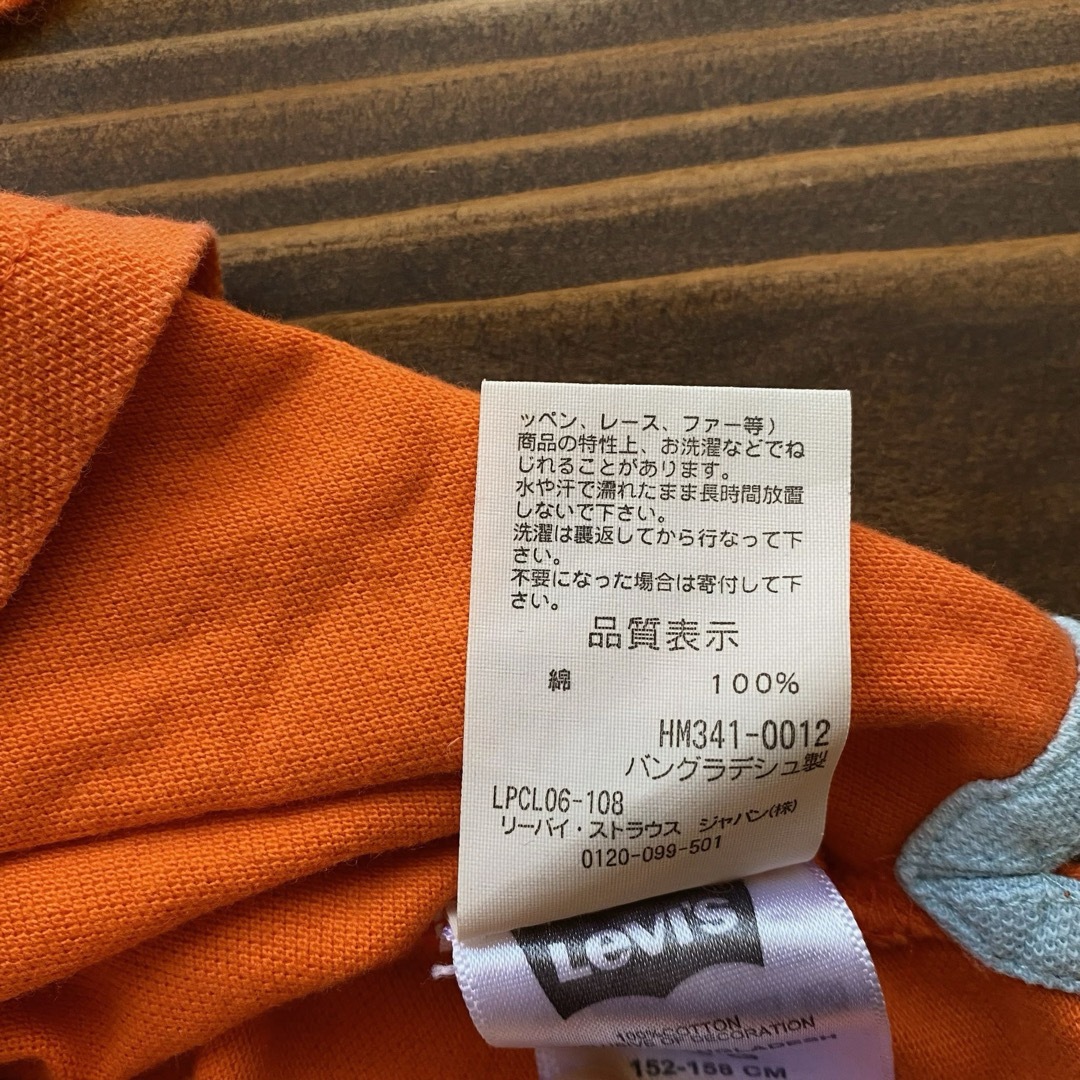 Levi's(リーバイス)のポロシャツ リーバイス 半袖 オレンジ 綿100% 中古 古着 Lサイズ メンズ メンズのトップス(ポロシャツ)の商品写真