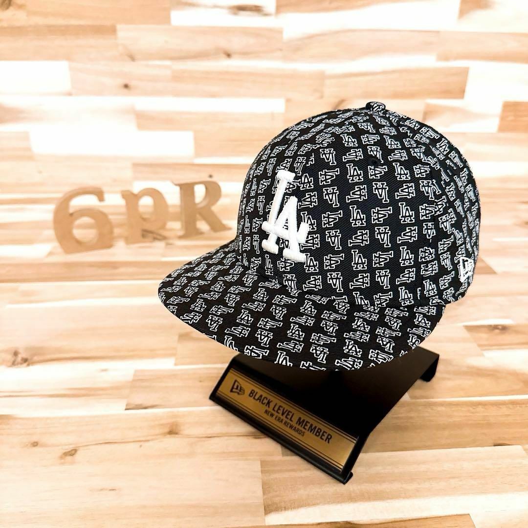 NEW ERA(ニューエラー)の激レア【ニューエラ×ドジャース】LA総柄ロゴ キャップ 海外 ビンテージ 黒×白 メンズの帽子(キャップ)の商品写真