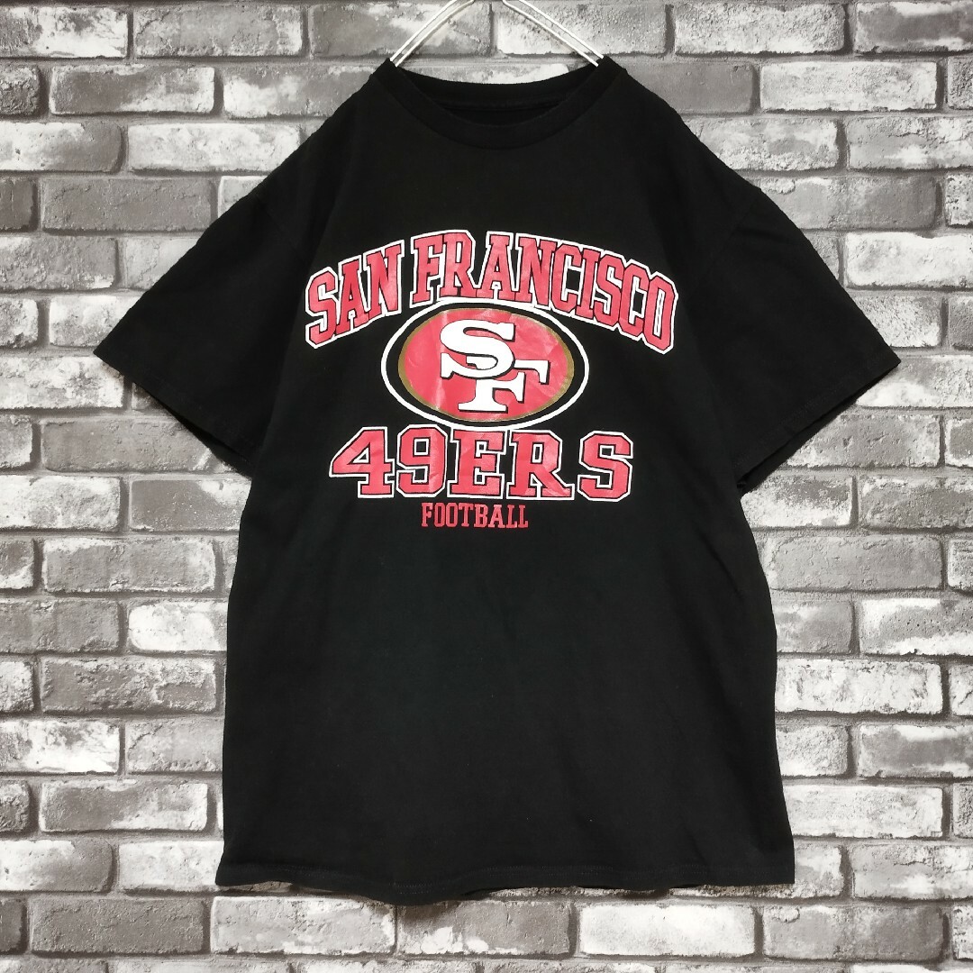 NFLサンフランシスコフォーティナイナーズアーチビッグロゴtシャツTシャツ黒 メンズのトップス(Tシャツ/カットソー(半袖/袖なし))の商品写真