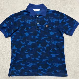 アベイシングエイプ(A BATHING APE)のAPE BAPE KAWS FIRE CAMO ポロシャツ　炎　FLAME(ポロシャツ)