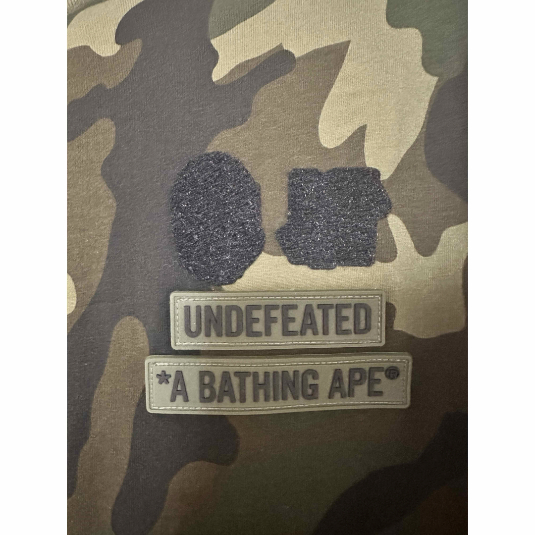 A BATHING APE(アベイシングエイプ)のBAPE X Undefeated Woodland Camo Tee メンズのトップス(Tシャツ/カットソー(半袖/袖なし))の商品写真