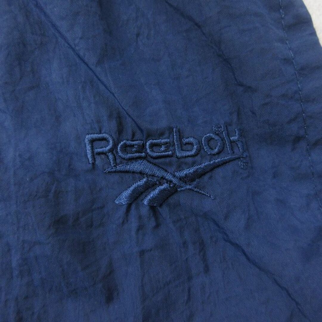 Reebok(リーボック)のW37★古着 リーボック REEBOK ナイロン パンツ メンズ 90年代 90s ワンポイントロゴ 紺 ネイビー 24may11 中古 ボトムス ロング メンズのパンツ(ワークパンツ/カーゴパンツ)の商品写真