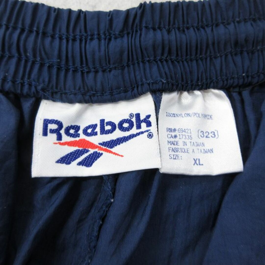 Reebok(リーボック)のW37★古着 リーボック REEBOK ナイロン パンツ メンズ 90年代 90s ワンポイントロゴ 紺 ネイビー 24may11 中古 ボトムス ロング メンズのパンツ(ワークパンツ/カーゴパンツ)の商品写真