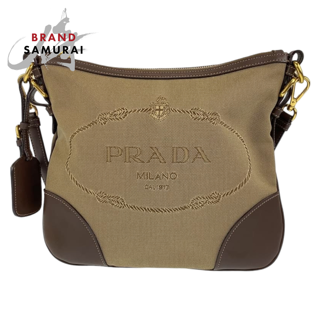 PRADA(プラダ)の美品 PRADA プラダ ロゴジャガード ベージュ 薄茶色 ブラウン 茶 キャンバス ショルダーバッグ 斜め掛け レディース 405793 【中古】 レディースのバッグ(ショルダーバッグ)の商品写真