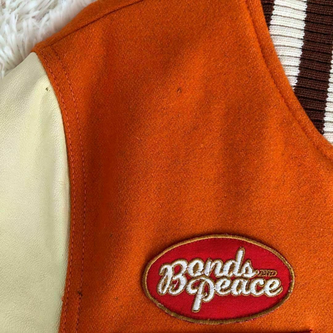 BONDS＆PEACE(ボンズアンドピース)のBONDS&PEACEボンズアンドピース　スタジャン羊革オレンジ色　M メンズのジャケット/アウター(スタジャン)の商品写真